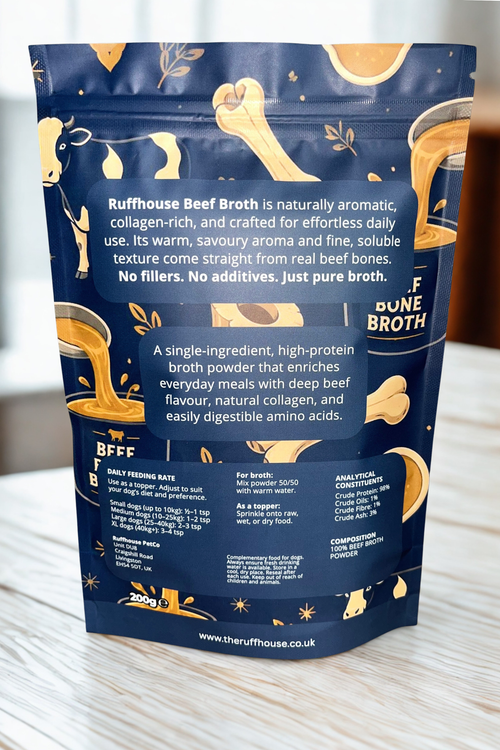 Ruff House Beef Bone Broth back of pack showing feeding instructions, human grade 98 percent protein details, storage guidance, and daily use recommendations for dogs over four months.
