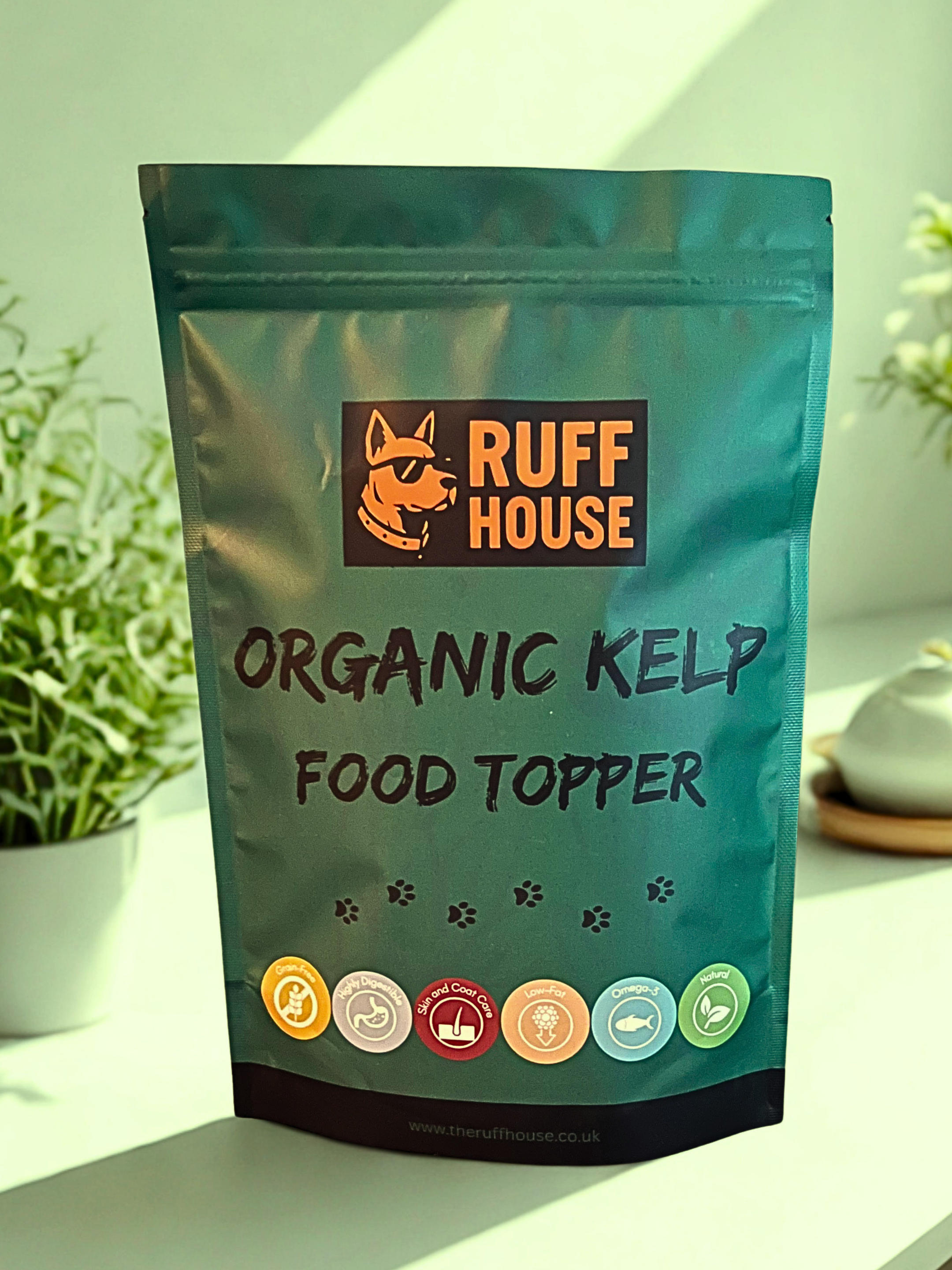 Ruff House Organic Kelp Food Topper front of pack showing the teal pouch with grain free, healthy digestion, skin and coat care, low fat, omega 3 and natural benefits.
