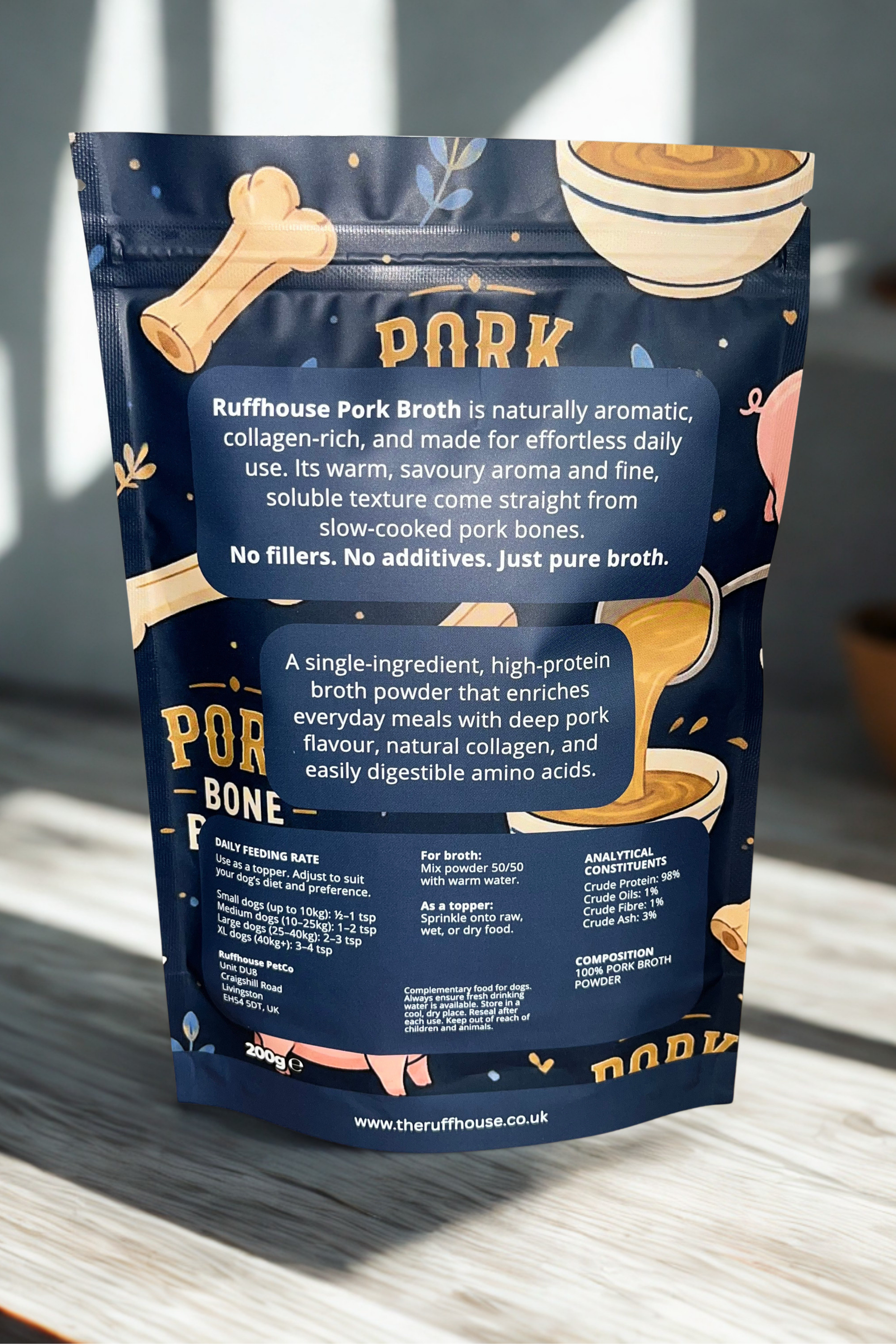 Ruff House Pork Bone Broth back of pack showing feeding instructions, human grade 98 percent protein details, storage guidance, and daily use recommendations for dogs over four months.