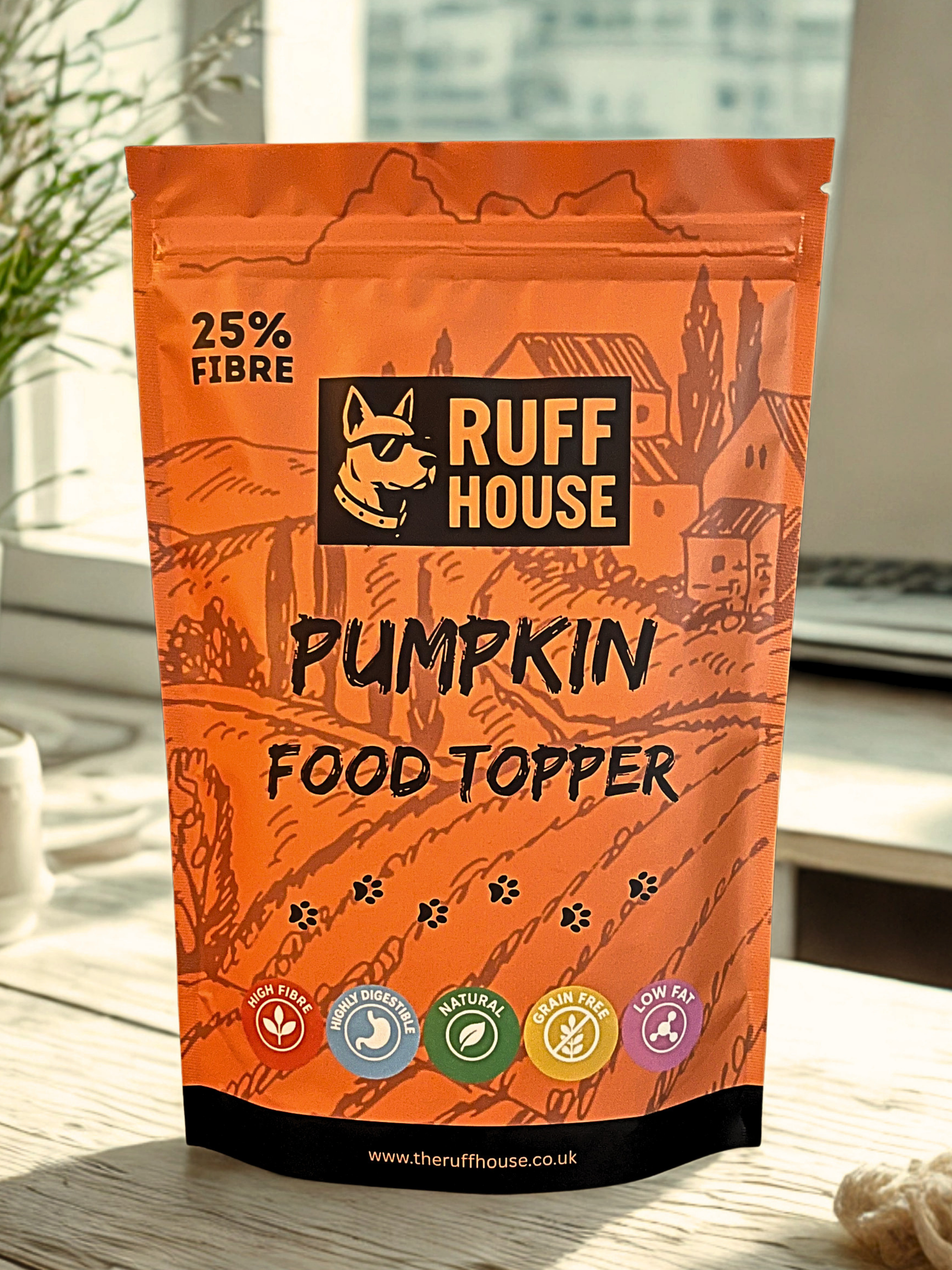 Ruff House Pumpkin Food Topper front of pack showing the orange pouch with high fibre, digestible, natural, grain free and low fat benefits.