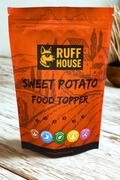 Ruff House Sweet Potato Food Topper front of pack showing the orange pouch with high fibre, digestible, natural, grain free and low fat benefits.